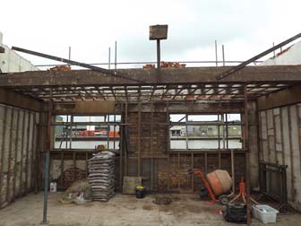 Orginal mezzanine floor supported by Acrow Prop.