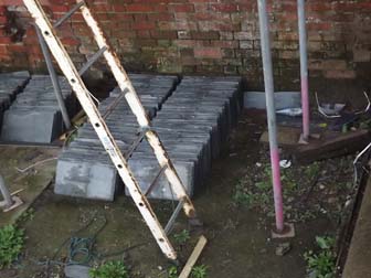 Tiles waiting fixing on roof.