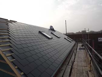 Full length view of roof - North side.